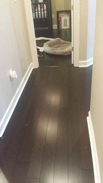 Dark brown LVT flooring installation
