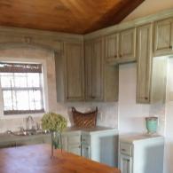 Kitchen remodel with distressed cabinets and large butcherblock island