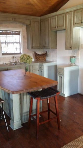Kitchen remodel with distressed cabinets and large butcherblock island