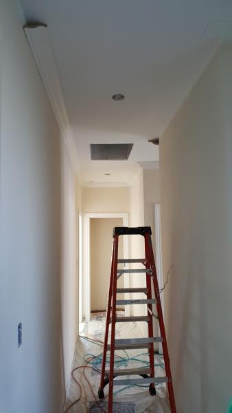Crown molding installation in hallway