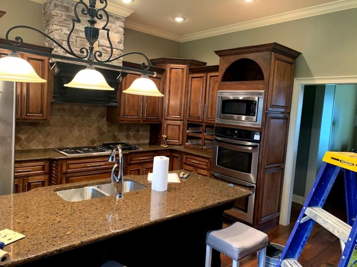 Dark stained kitchen cabinets