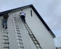 Painting exterior of a brick home