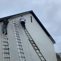 Painting exterior of a brick home