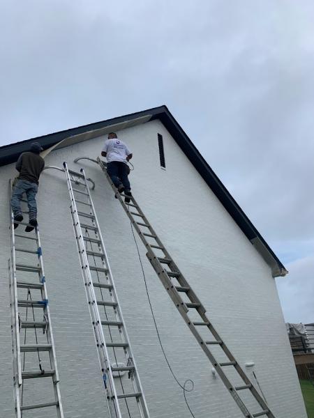 Painting exterior of a brick home