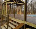 Wooden pool deck with covered area